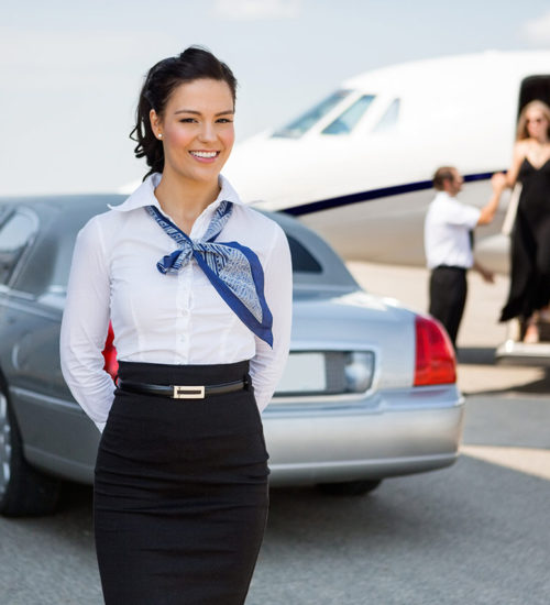 A woman in a white shirt and black skirt