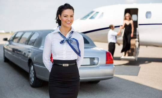 A woman in a white shirt and black skirt