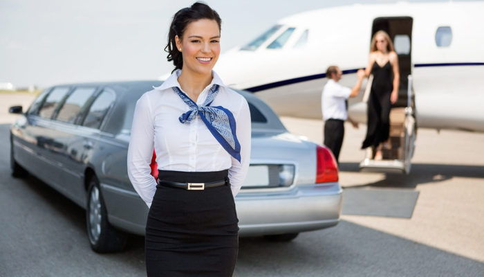 A woman in a white shirt and black skirt