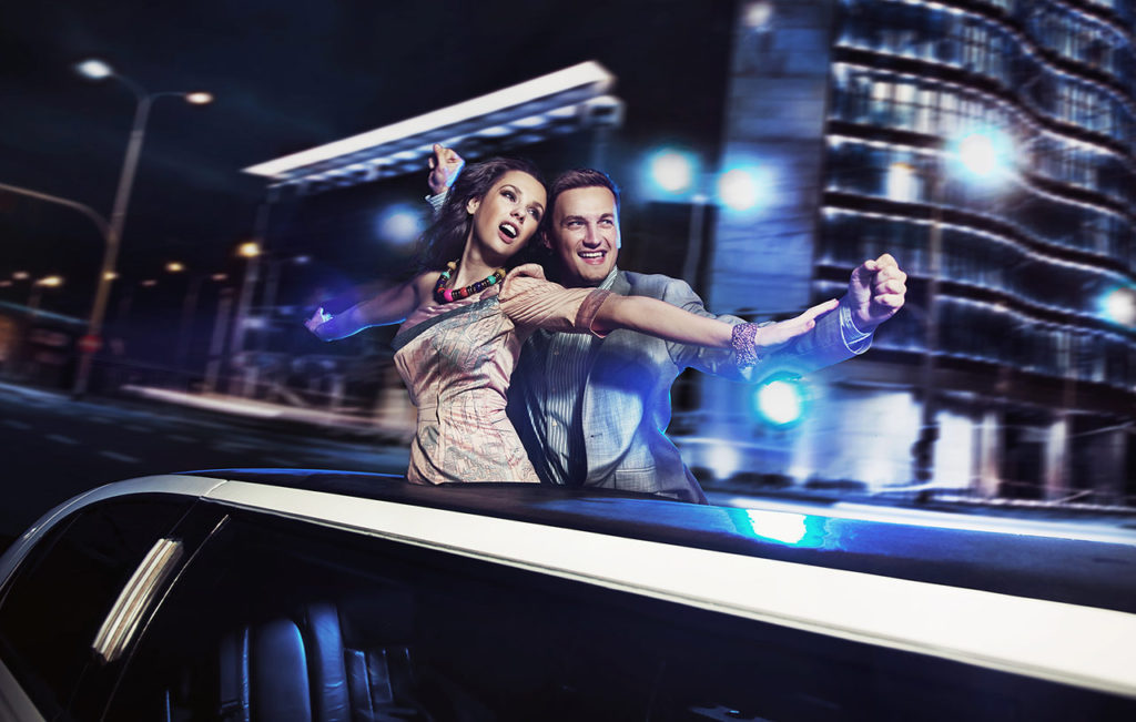 A man and woman are driving in the car.
