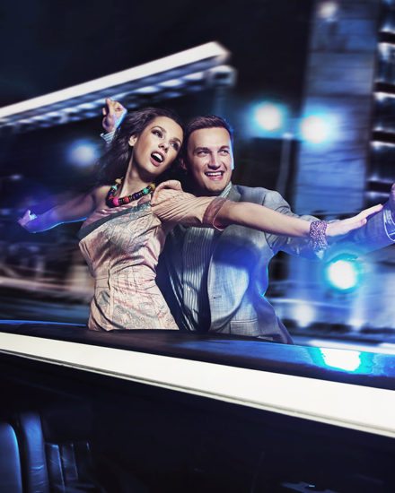 A man and woman are driving in the car.