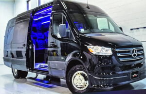 Black Mercedes van with open side door.