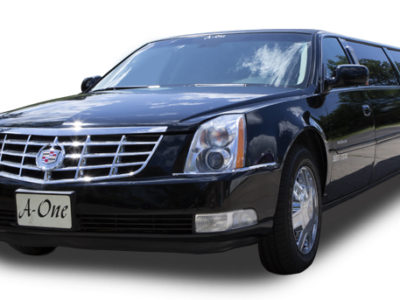 A black car is parked in front of the camera.